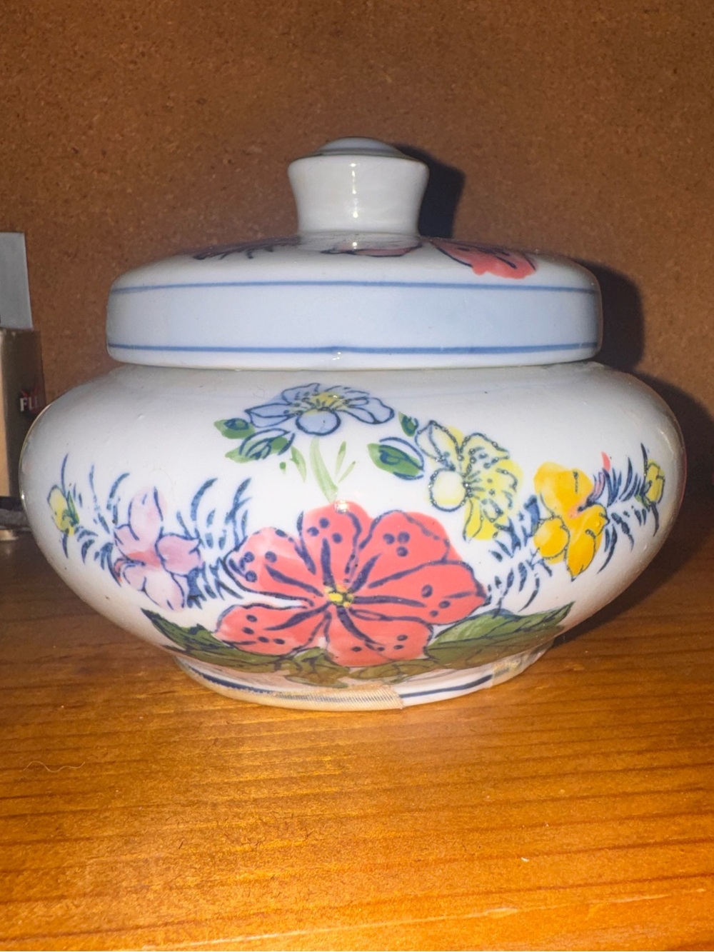 Vintage Blue and white pottery jar with lid.. Flower motif.